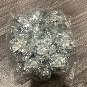 NEW assorted sizes of small disco balls that come with strings to hang